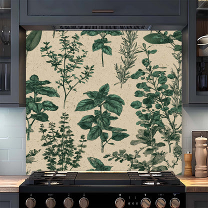 Kitchen stove with a decorative glass backsplash featuring green leaf patterns.