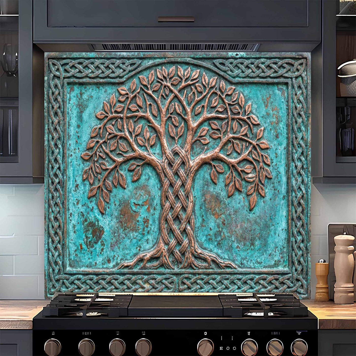 Decorative glass backsplash with tree design above a stove in a kitchen