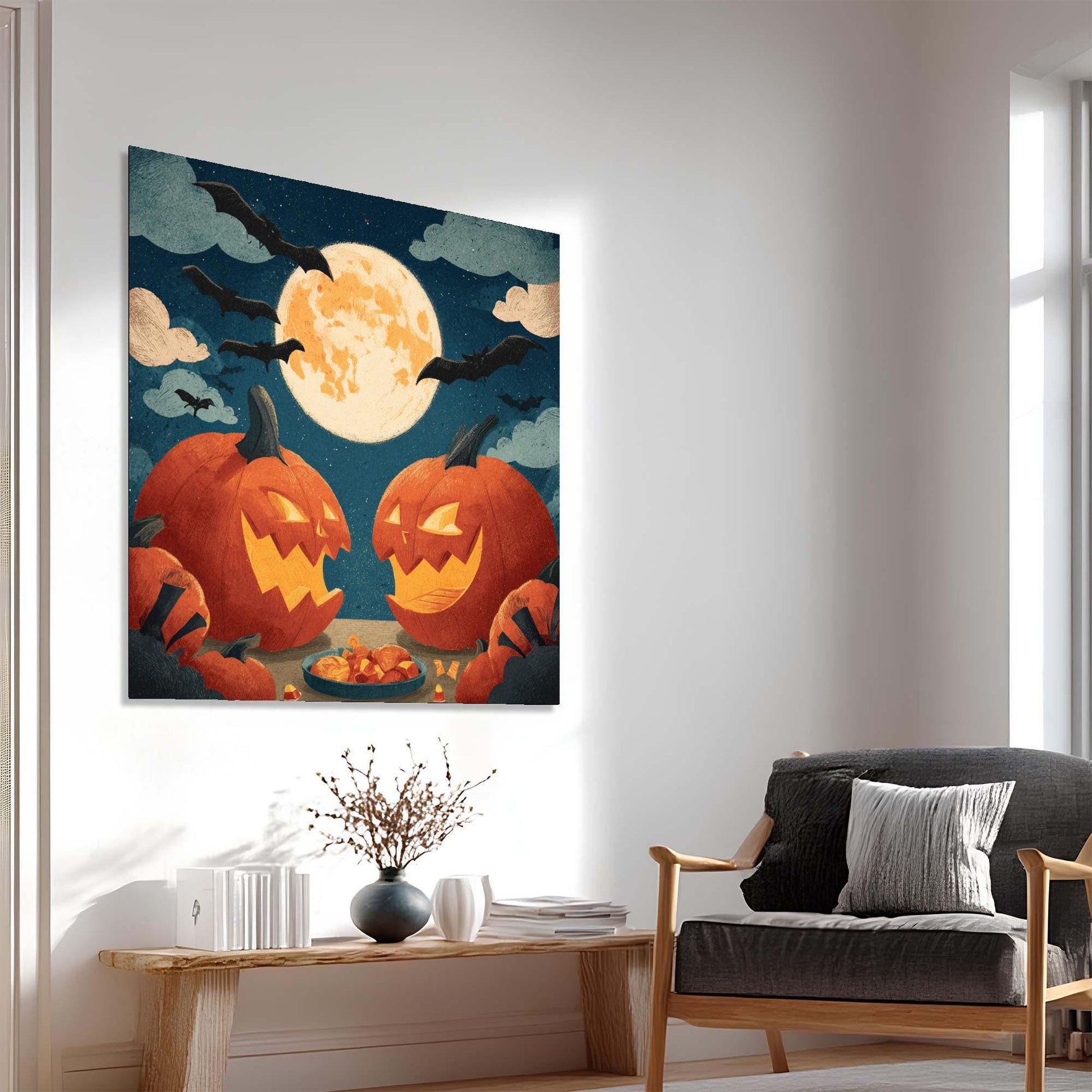 Halloween-themed wall art with pumpkins and a full moon in a living room setting.