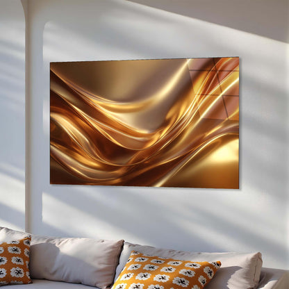 Abstract gold artwork on a wall above a sofa with decorative pillows.