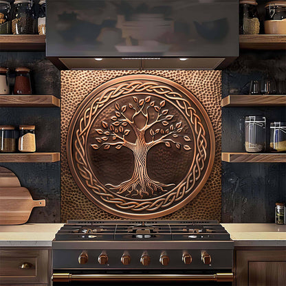 Decorative copper tree of life backsplash above a stove in a kitchen.