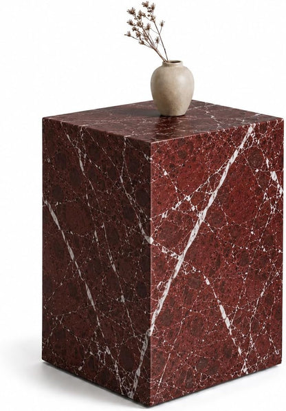 Marble side table with a vase on top against a white background