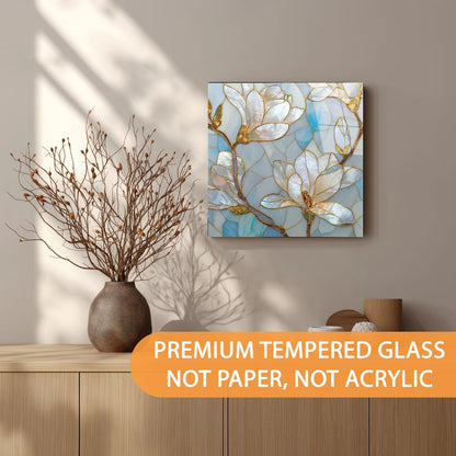 Decorative wall art with floral design on a wall above a wooden shelf.
