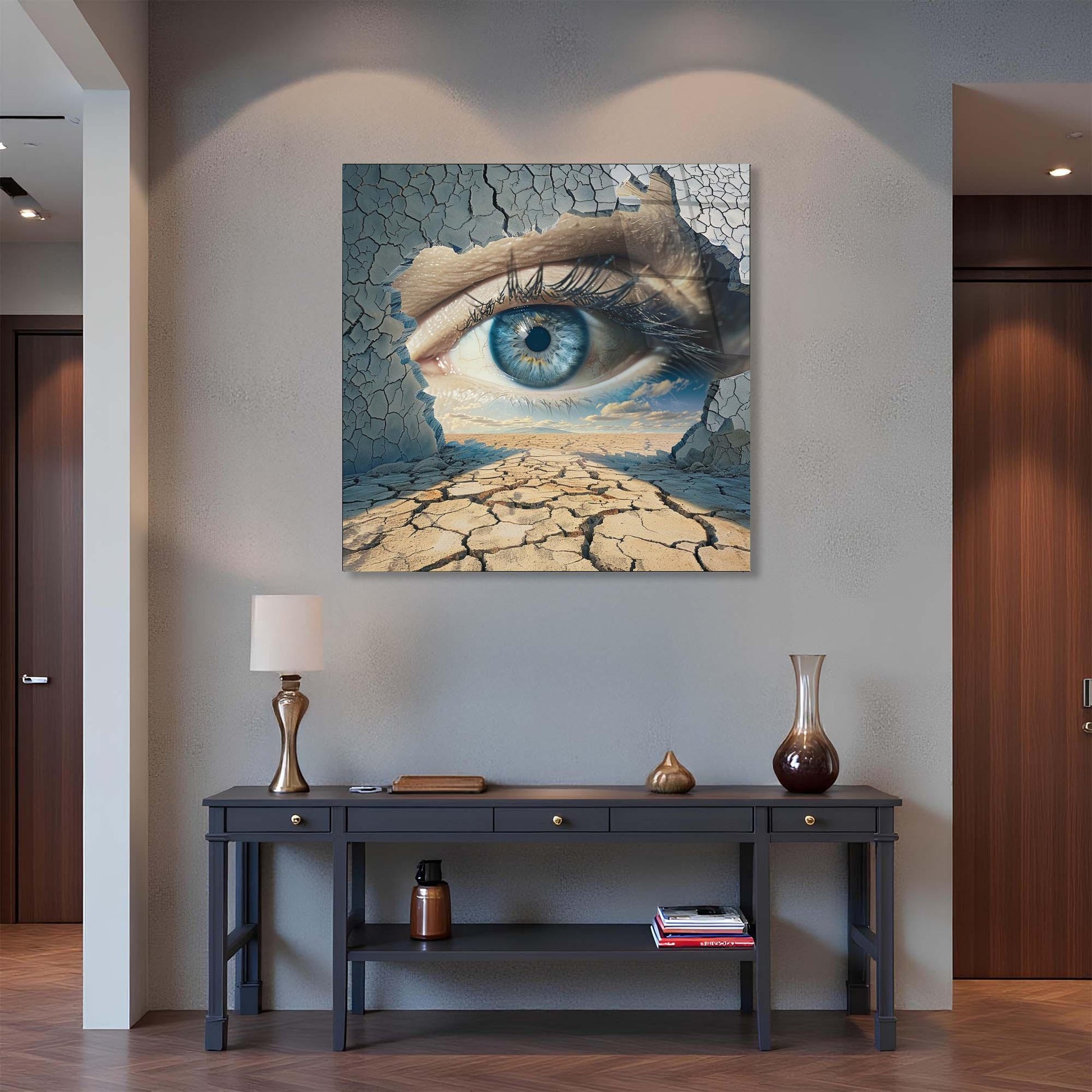 Modern interior with a unique eye-themed painting on the wall above a console table.