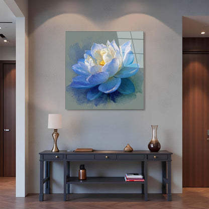 Framed artwork of a blue and white flower on a wall above a console table.