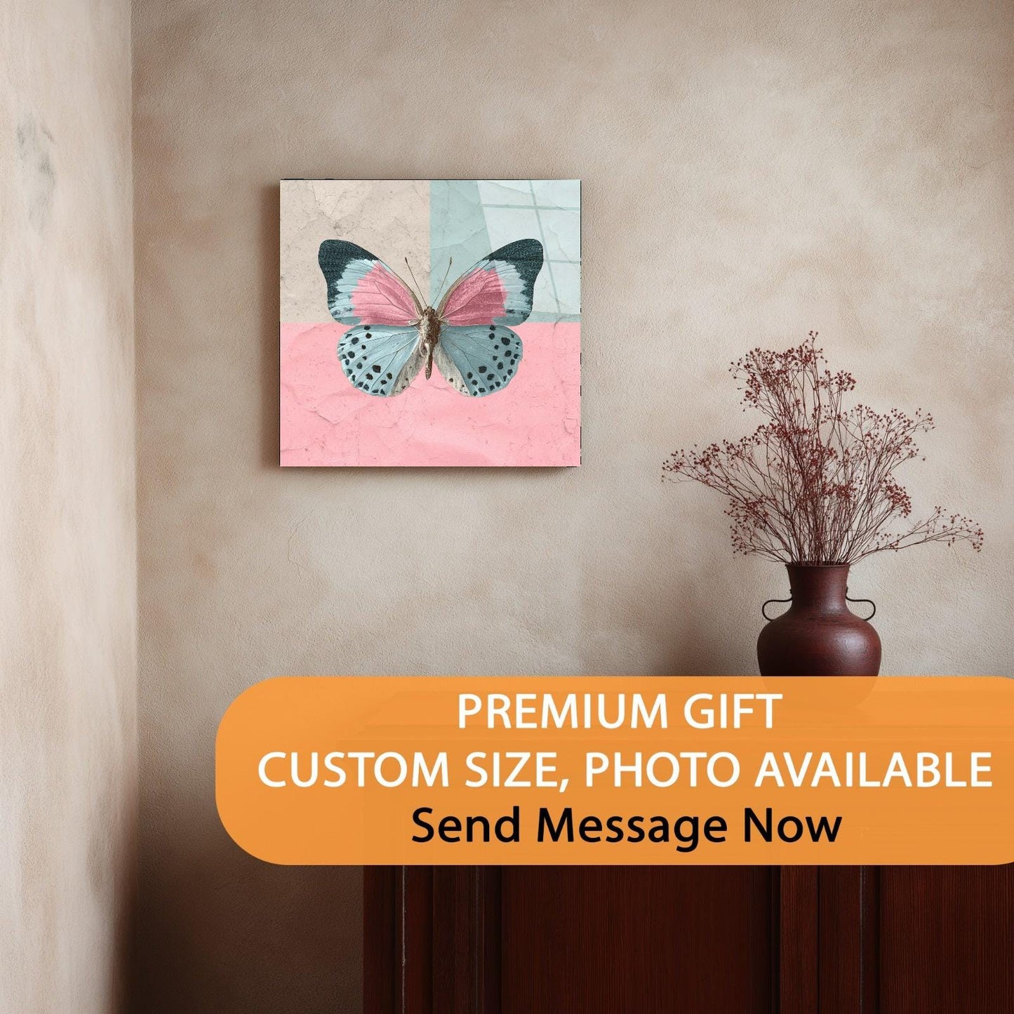 Canvas print of a butterfly on a pink and blue background hanging on a wall.
