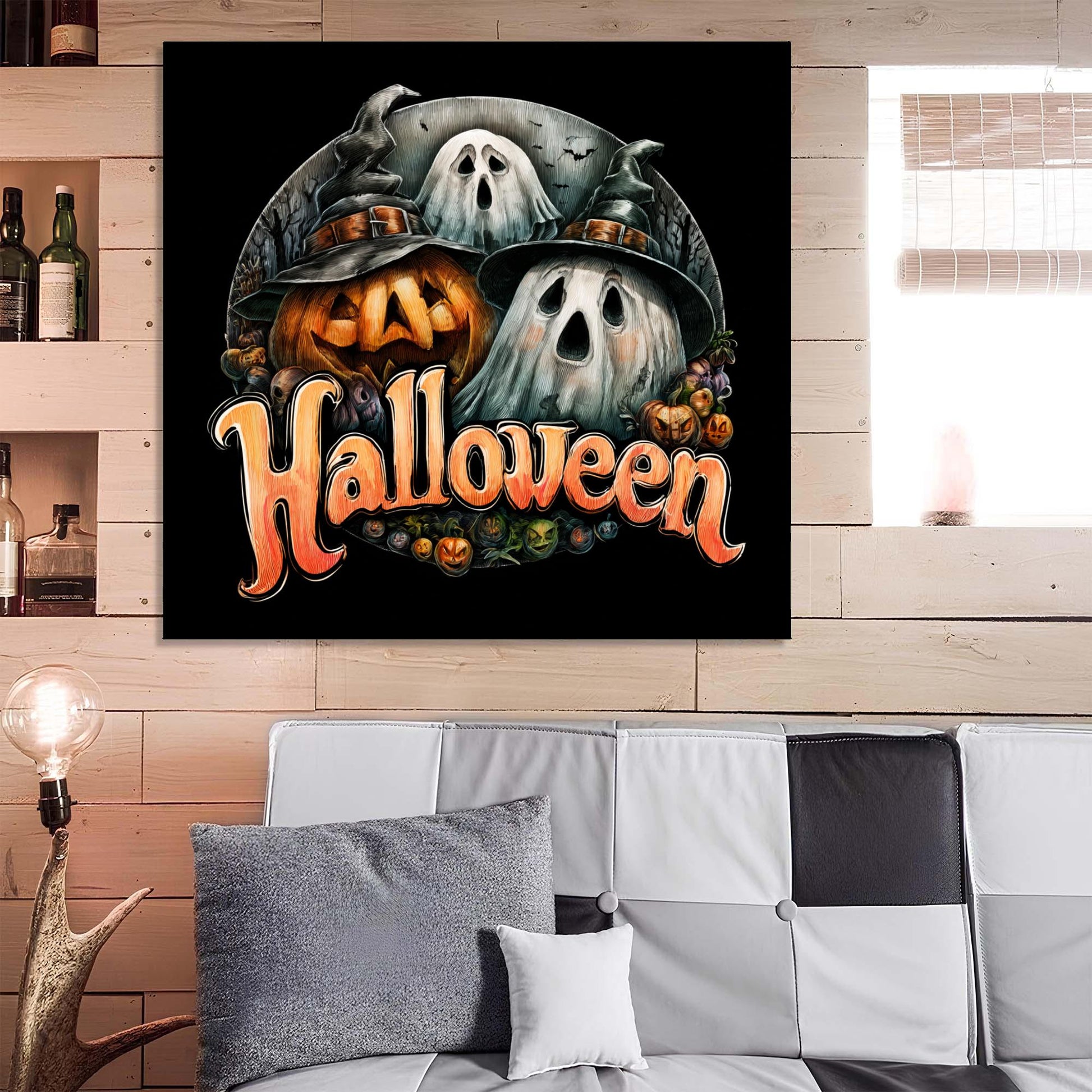 Halloween-themed wall art with pumpkins and ghosts on a black background, displayed above a sofa.
