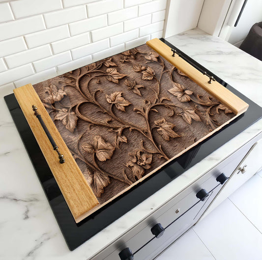 Decorative wooden stove top cover with floral carvings on a stove in a kitchen setting