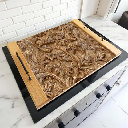Decorative wooden panel with intricate carvings on a kitchen counter.