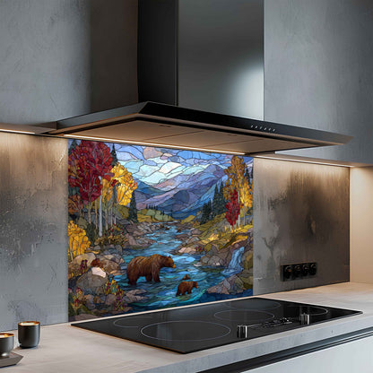 Modern kitchen with a decorative glass splashback featuring a nature scene.
