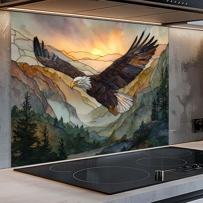 Kitchen with a decorative glass splashback featuring an eagle and mountain landscape.