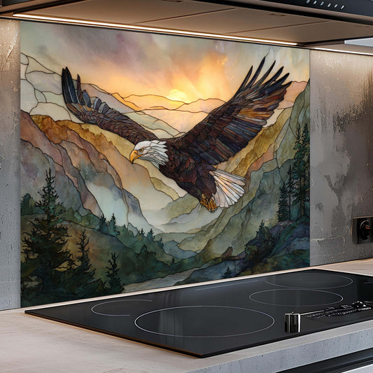 Kitchen with a decorative glass splashback featuring an eagle and mountain landscape.