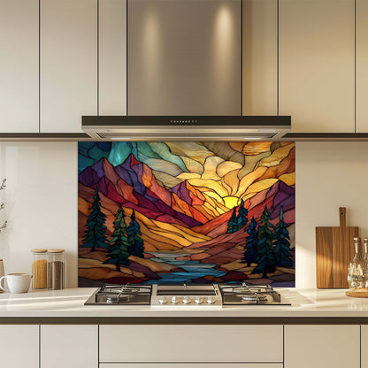 Kitchen with a colorful mountain landscape backsplash above a stove.