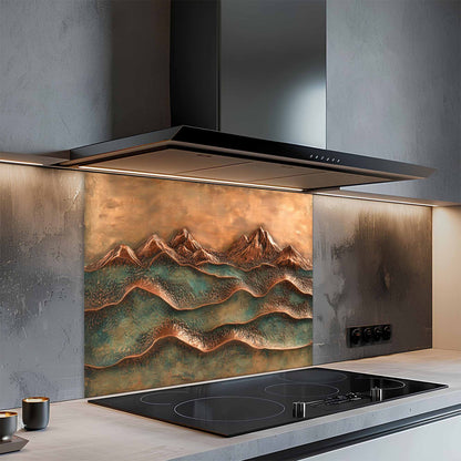 Modern kitchen with a decorative glass backsplash featuring mountain designs.