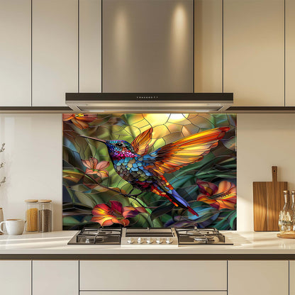 Colorful stained glass-style hummingbird design on a kitchen backsplash.