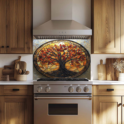 Stainless steel oven with a decorative glass backsplash featuring a tree design in a kitchen setting.