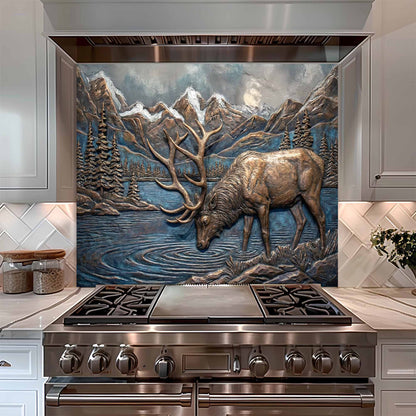 Stainless steel oven with decorative elk and mountain scene glass backsplash in a kitchen.