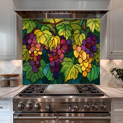 Stainless steel stove with colorful grapevine backsplash in a kitchen setting