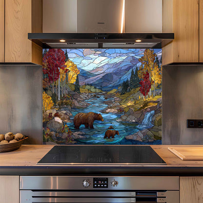 Kitchen with a decorative glass splashback featuring a bear and bear cubs by a stream.