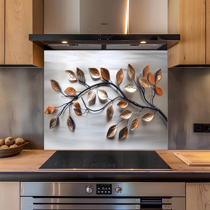 Modern kitchen with a decorative glass splashback featuring leaf patterns.