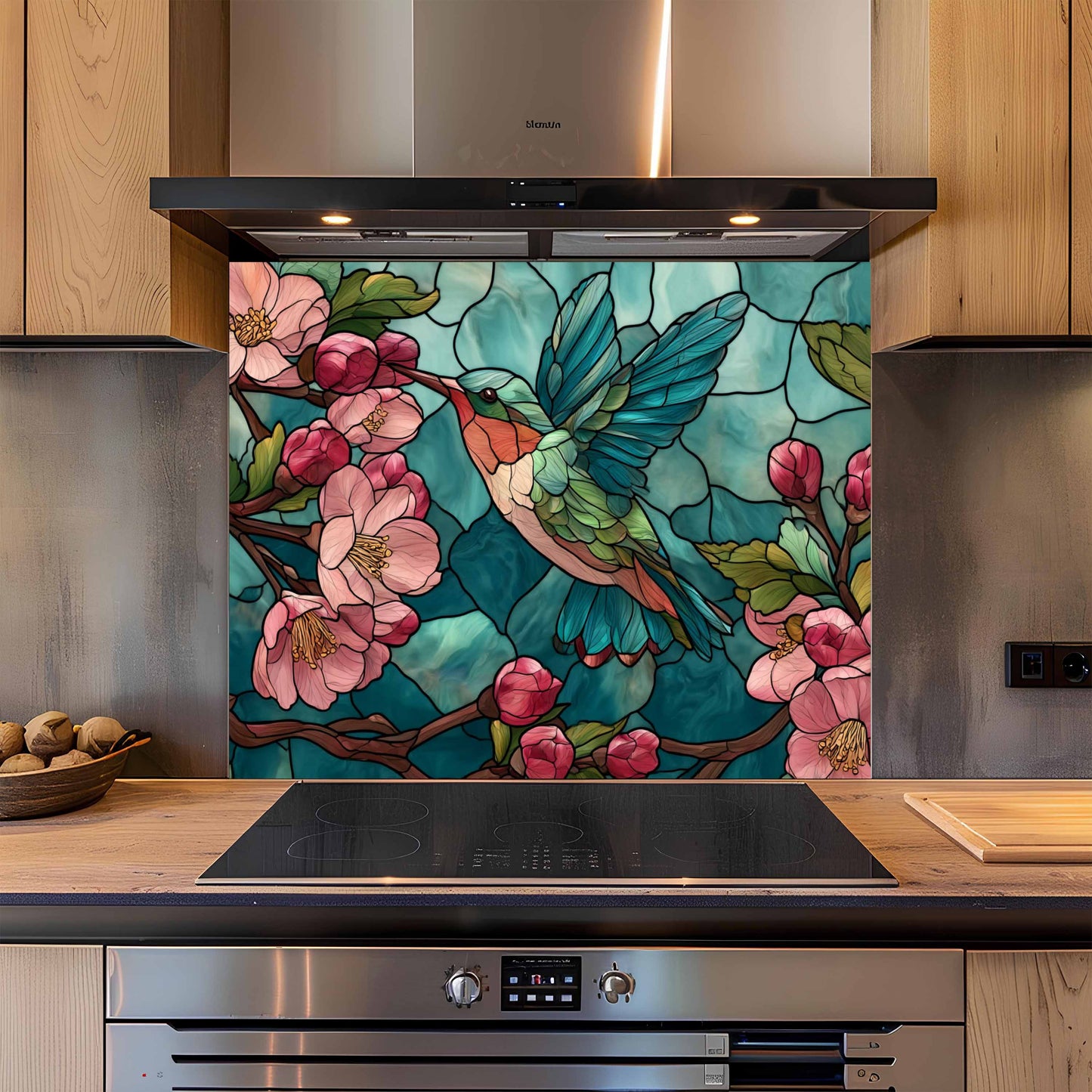 Kitchen with a decorative glass splashback featuring a hummingbird and flowers.