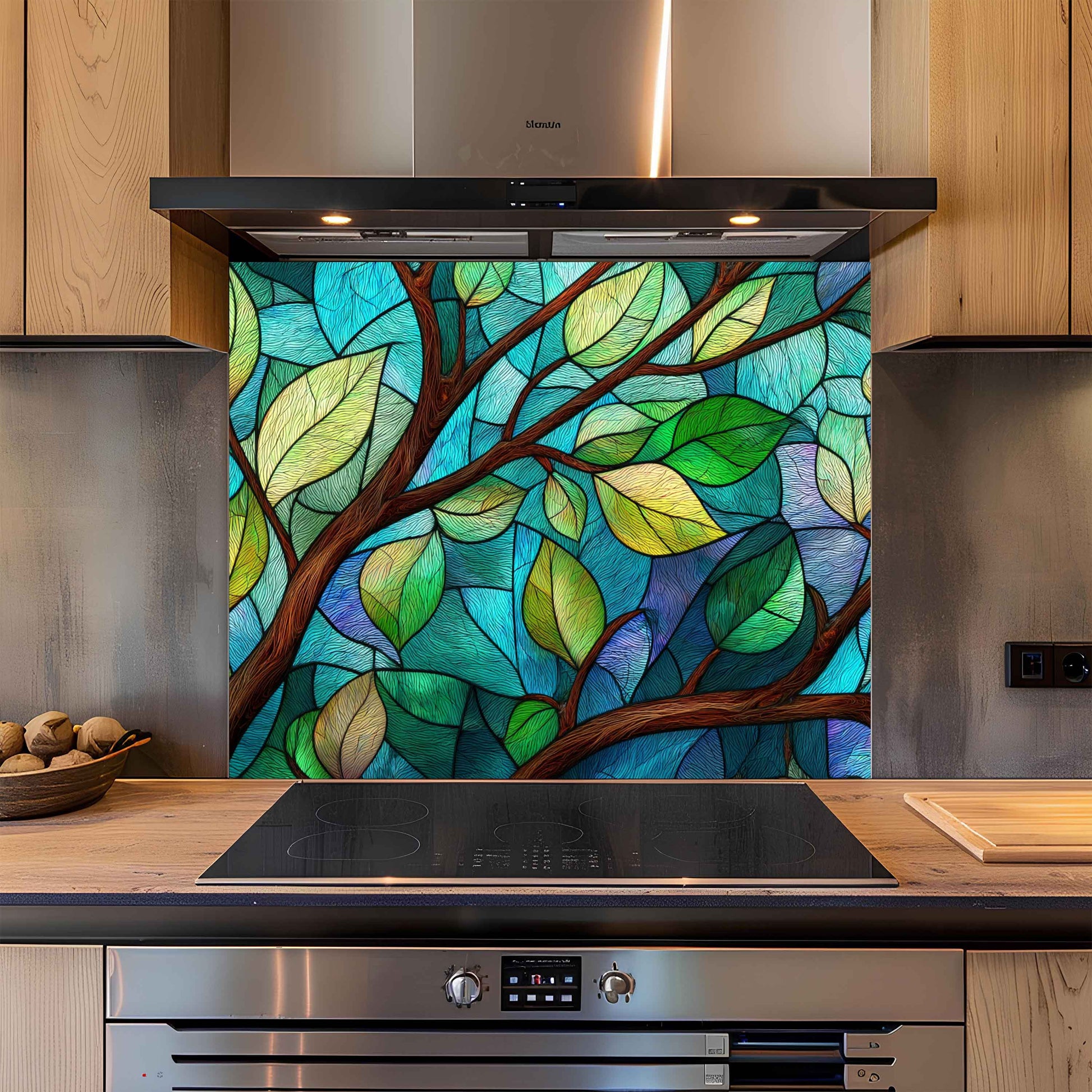 Kitchen with a decorative glass splashback featuring a tree design.