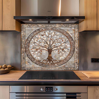 Decorative kitchen backsplash with tree design above a stove.