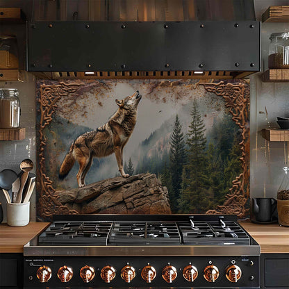 Stainless steel stove with decorative wolf glass backsplash in a kitchen setting