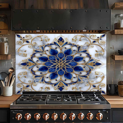 Decorative glass backsplash with blue and gold floral pattern above a stove in a kitchen.