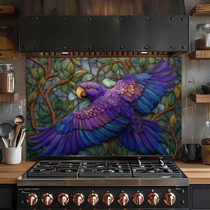 Stainless steel stove with a colorful parrot mural on the glass backsplash in a kitchen setting.