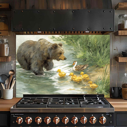 Stainless steel gas stove with a decorative glass backsplash featuring a bear and duck family scene.