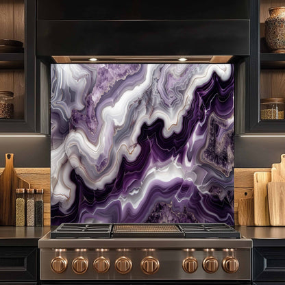 Stainless steel stove with a purple and white marbled backsplash in a kitchen setting.