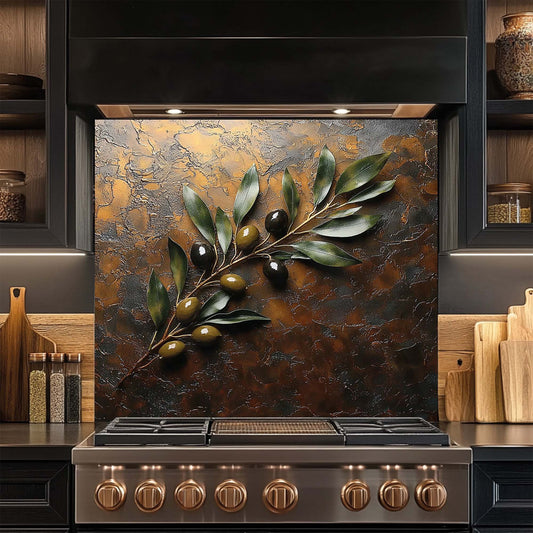 Stainless steel stove with decorative glass backsplash featuring green leaves and olives in a kitchen setting.