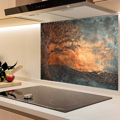 Kitchen with a decorative glass splashback featuring a tree design.