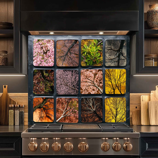 Stainless steel stove with decorative backsplash featuring nature-themed images in a kitchen setting.