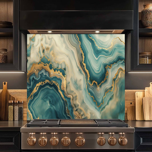 Stainless steel stove with a decorative backsplash featuring blue and gold marbled pattern in a kitchen setting.