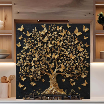 Decorative backsplash with a gold tree and butterflies on a black background in a kitchen setting.