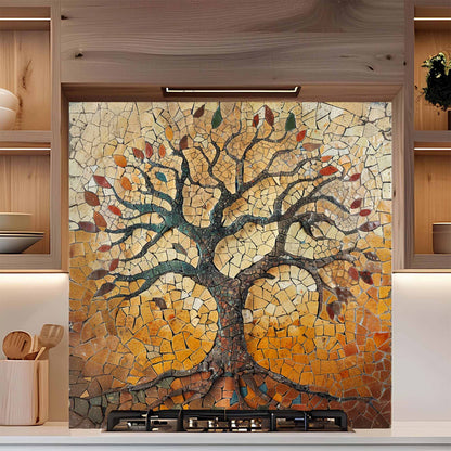 Mosaic tree design on a kitchen backsplash with wooden cabinets.