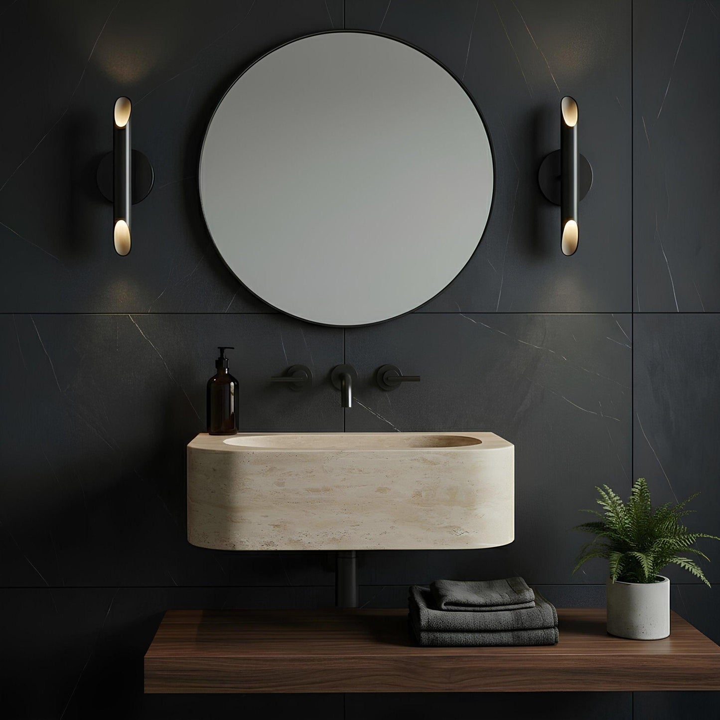 Modern bathroom setup with a round mirror, sink, and decorative elements on a dark tiled wall.
