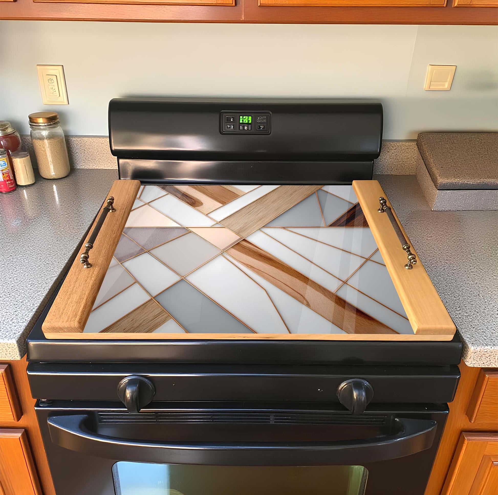 Stainless steel stove with decorative glass panel in a kitchen stove top