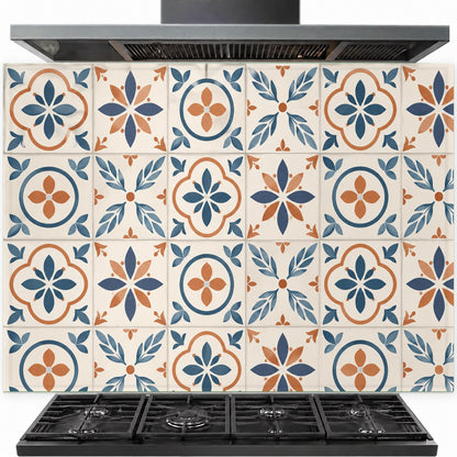Mediterranean tiles tempered glass backsplash installed behind a stainless steel kitchen stove