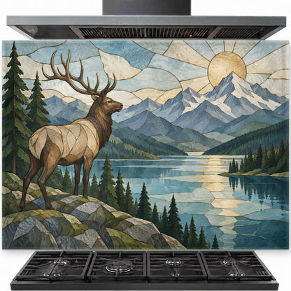 Elk River tempered glass backsplash installed behind a professional gas stove in a rustic cabin kitchen.