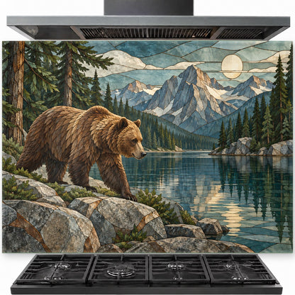 Rustic mountain bear tempered glass backsplash installed behind a gas stove in a cozy log cabin kitchen.
