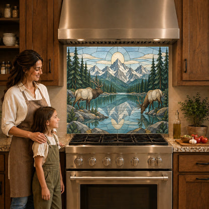 Rustic cabin kitchen featuring a deer and mountain river glass backsplash panel behind a modern induction stove.