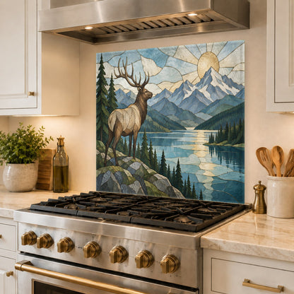 Stunning mountain and river elk design glass backsplash guard protecting a kitchen wall behind the stove.