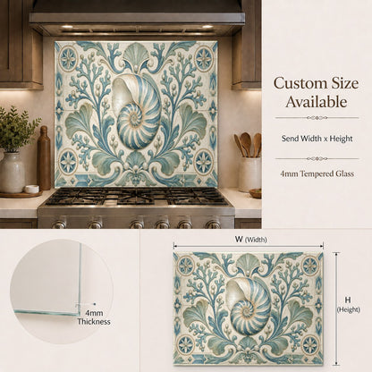 Sleek kitchen island cooking station featuring a protective coastal themed glass backsplash.
