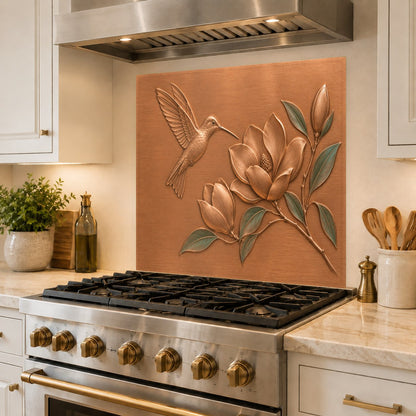Close-up of heat-resistant glass backsplash featuring hummingbirds behind a cooktop