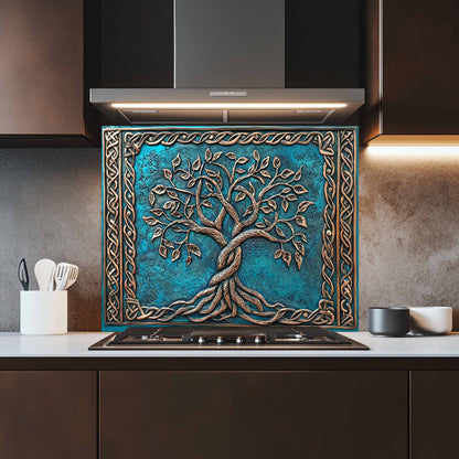 Decorative splashback with a tree design above a stove in a kitchen.