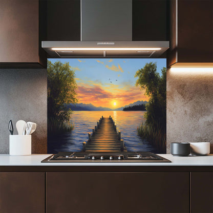 Kitchen with a decorative glass splashback featuring a sunset over water scene.