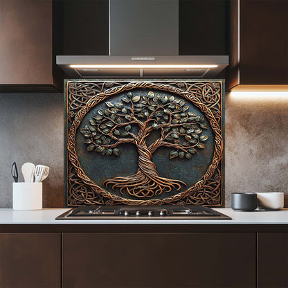 Decorative glass backsplash with a tree design above a kitchen stove.